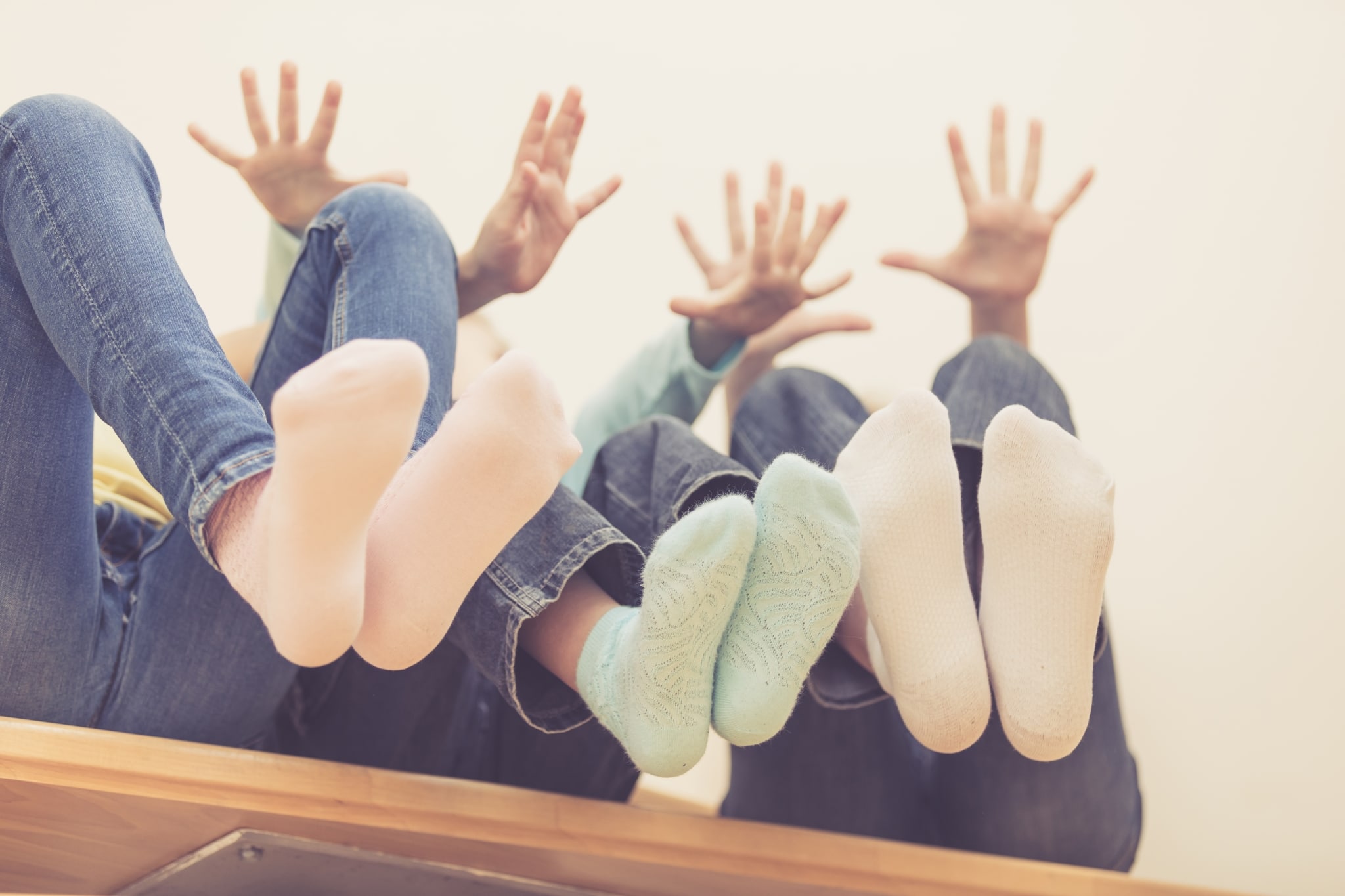 Happy Children Which Are Sitting On The Stairs In The House.